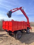 Truck mounted excavator for digging, loading, and transportation in the sand field