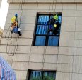 Professional cleaning of exterior walls of buildings, efficient and safe cleaning of walls by wiping glass