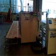 Fully automatic palletizing machine operates on different lengths of wood to reduce employees