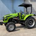 Wholesale of agricultural four wheeled tractors with high flower tires for paddy fields