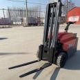 Station driven fully electric forklift for handling and stacking, hand supported vertical stacker