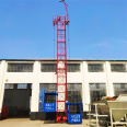 Fix one column and two cages with a construction material elevator on the construction site. Safety of construction elevators for preventing falling, single occupancy, and double cages