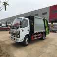 Multi functional 4-way compression Garbage truck delivered to the door by garbage extrusion truck at the airport