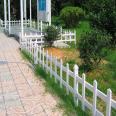 Green lawn guardrail in the park community, PVC plastic steel fence, flower pond garden isolation fence, spring rain