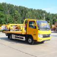 Double sided linkage operation of a Fukuda obstacle clearing vehicle with one tow two road rescue flatbed trailer