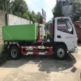 Dongfeng Xiaokang 3-way carriage detachable hook arm garbage truck with blue license plate can enter the underground garage, with one vehicle equipped with multiple containers