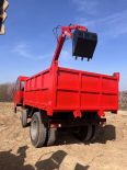 Truck mounted excavator for digging, loading, and transportation in the sand field