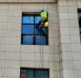 Professional cleaning of exterior walls of buildings, efficient and safe cleaning of walls by wiping glass