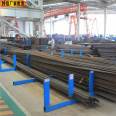 Scaffolds for placing steel bars on the construction site. Stacking of steel bars on the construction site. Scaffolds for steel bars on the construction site. Ruishuo has a large stock of steel bars in stock