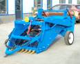 Four wheeled tractor with agricultural stone picker, automatic small stone screener for land reclamation, agricultural gravel collector