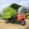 Three wheeled feed feeding truck, cattle and sheep feed spreading truck, diesel dual side discharge feeding truck