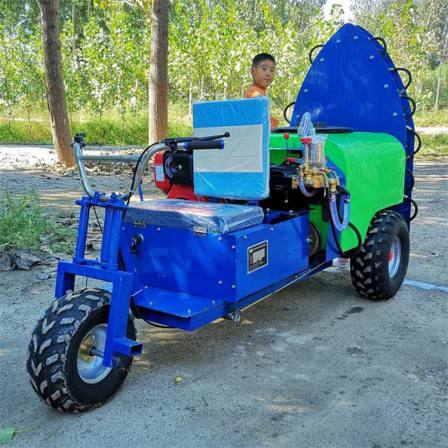 Orchard pesticide sprayer in the morning three wheeled rear air driven pesticide sprayer atomizes diesel spray