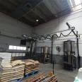 Vertical column straight arm gas suction crane, coil material handling and lifting, vacuum stacking and feeding machine, manufactured by Koman