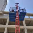 Fix one column and two cages with a construction material elevator on the construction site. Safety of construction elevators for preventing falling, single occupancy, and double cages