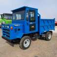 A brand new four wheel tractor with 25 horsepower and a four wheel truck for pulling wood agricultural transport