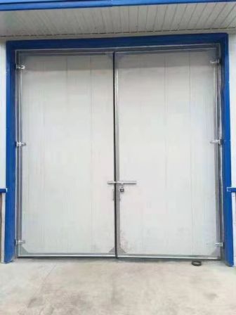 Steel structure factory doors can be equipped with small doors and windows for good insulation. Stainless steel factory distribution room electric swing door, Deshun