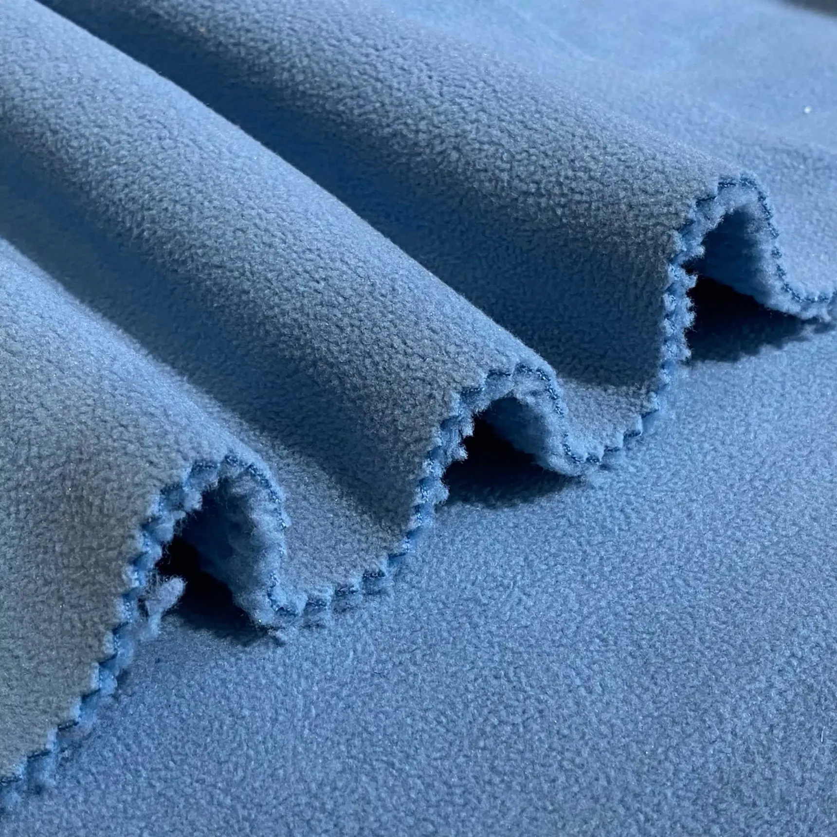 Get cozy with our Super Soft Polyester Sherpa Fabric Bonded Polar Fleece