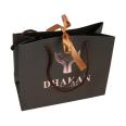 Luxury Black Gift Paper Bag Nylon Handles Custom Made Printed Logo Jewellery Packaging Coated Shopping Paper Bag With Ribbon