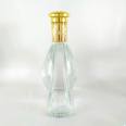 Wholesale 700ml unique shape glass bottle for XO/brandy bottle with crown cap